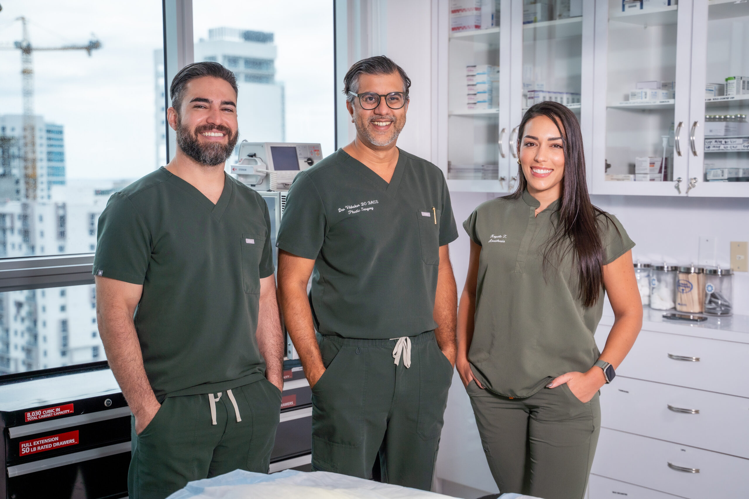 Yoel Tapanes, Dr. Dev Vibhakar, Krysal Tapanes in a surgical room at their Miami office