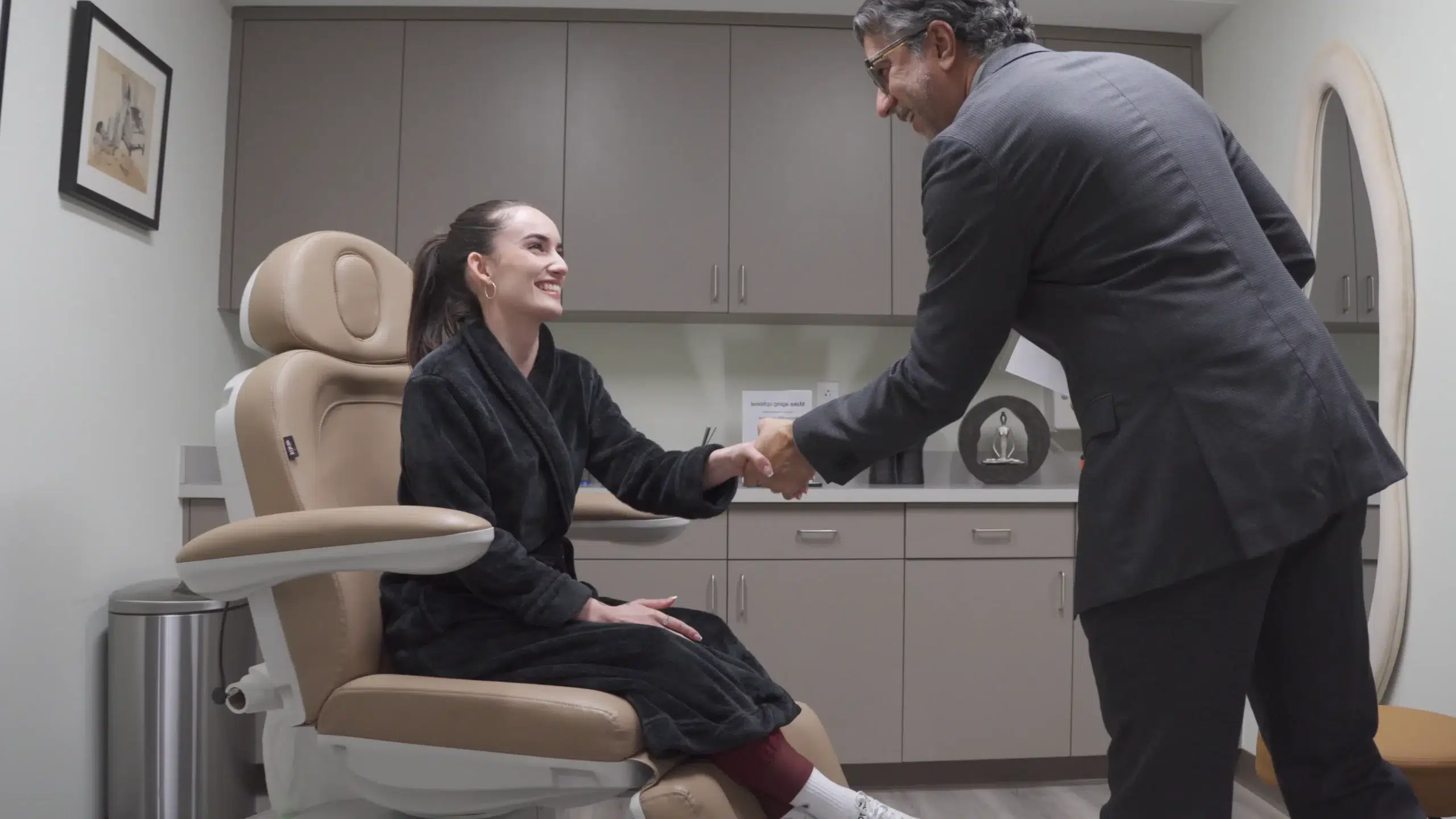 Dr Dev Greeting Patient