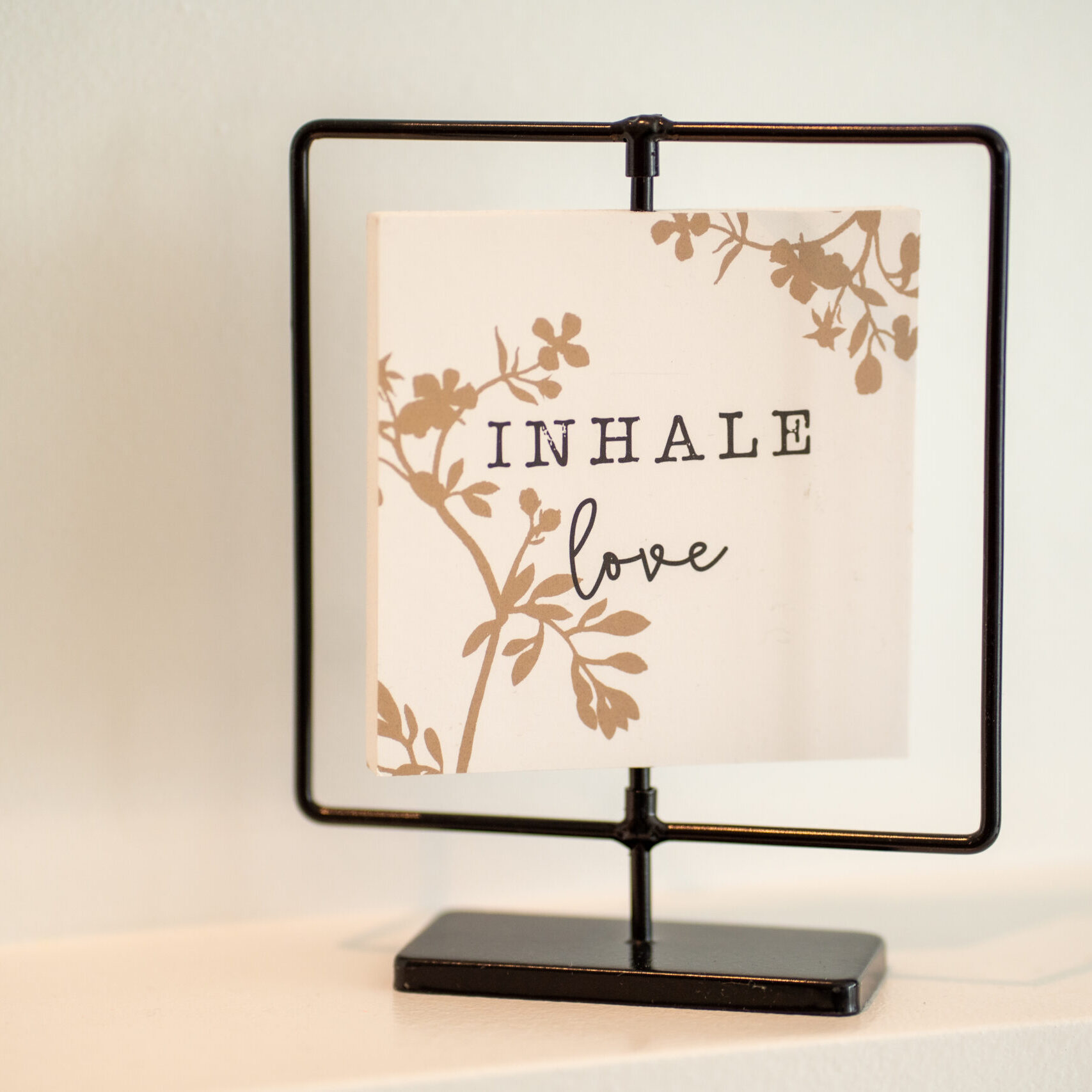 Enso Inhale Sign saying inhale love at Enso Plastic Surgery office